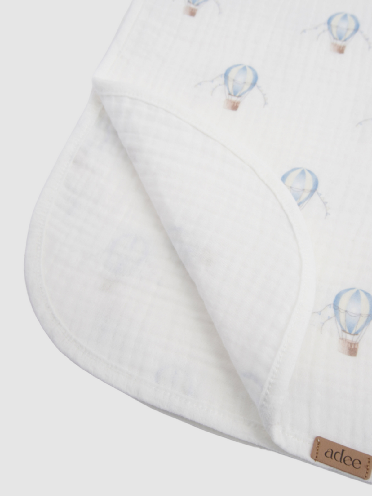 Blue Balloon Blanket swaddle by Adee for boys; white fabric with light blue hot-air balloon print