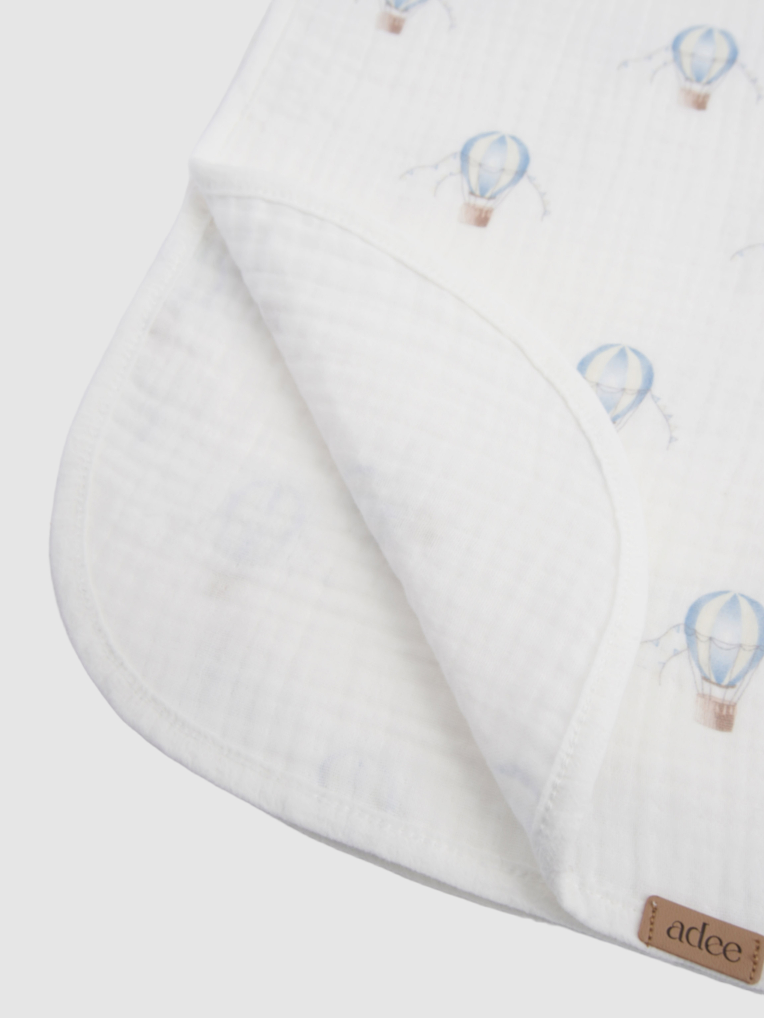 Blue Balloon Blanket swaddle by Adee for boys; white fabric with light blue hot-air balloon print