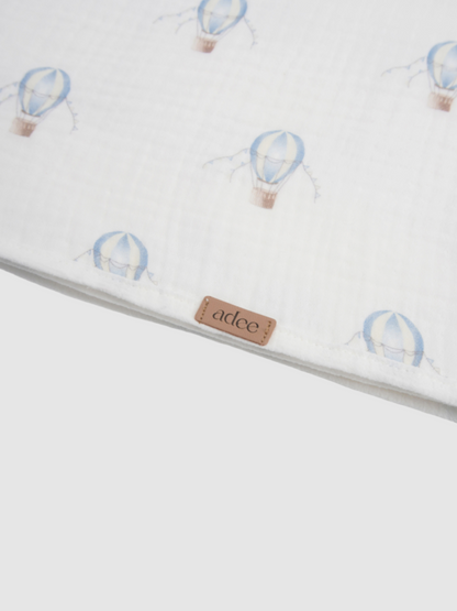 Blue balloon swaddle blanket for boys by Adee, white fabric with light blue balloon motifs