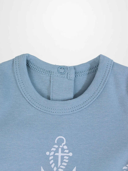 Blue Anchor Stretchy baby jumpsuit footie with white rope loops and centered anchor on breathable fabric.
