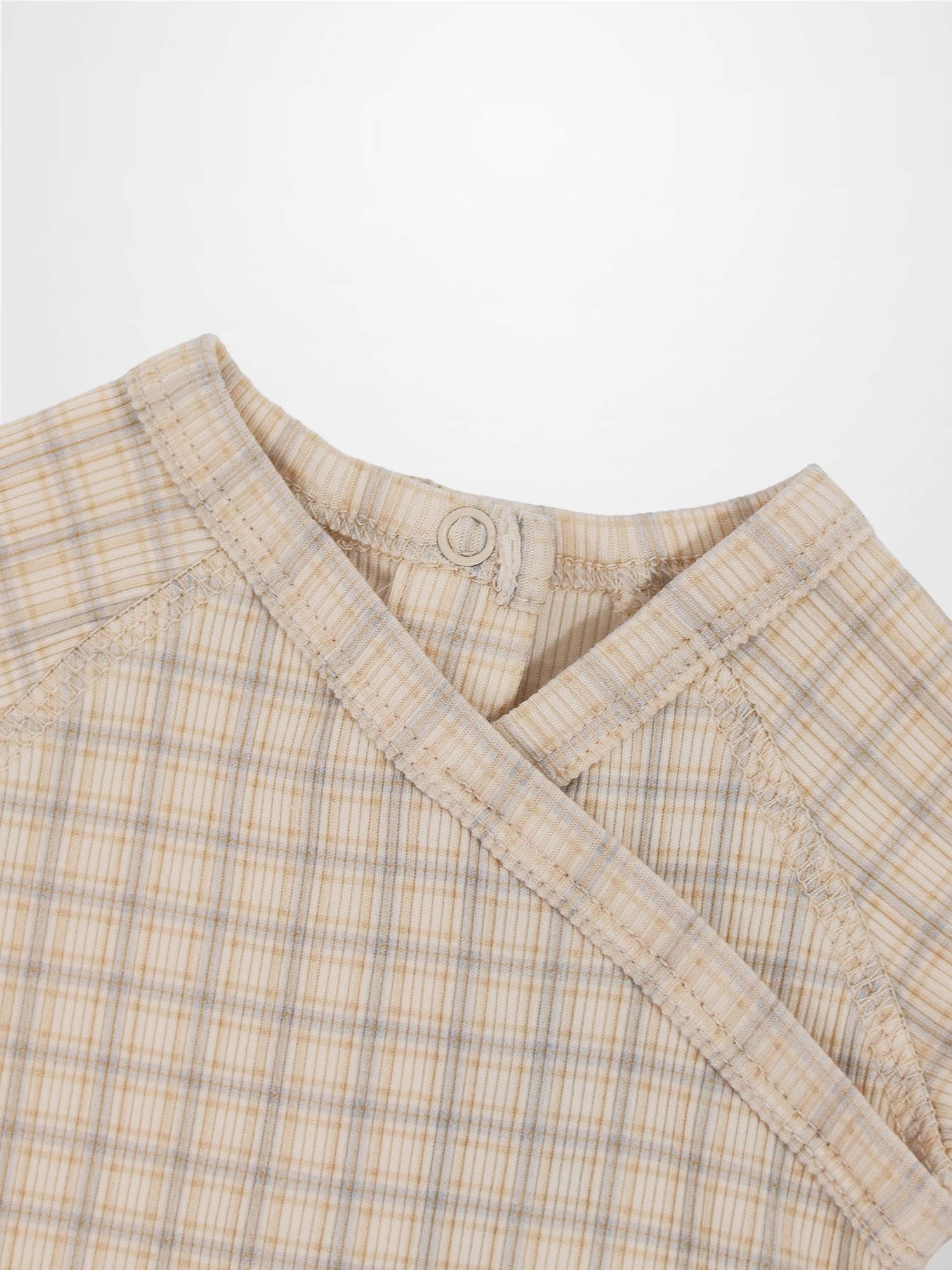 Oatmeal grid-pattern baby jumpsuit in beige with light blue plaid, crossover neck and back snap.