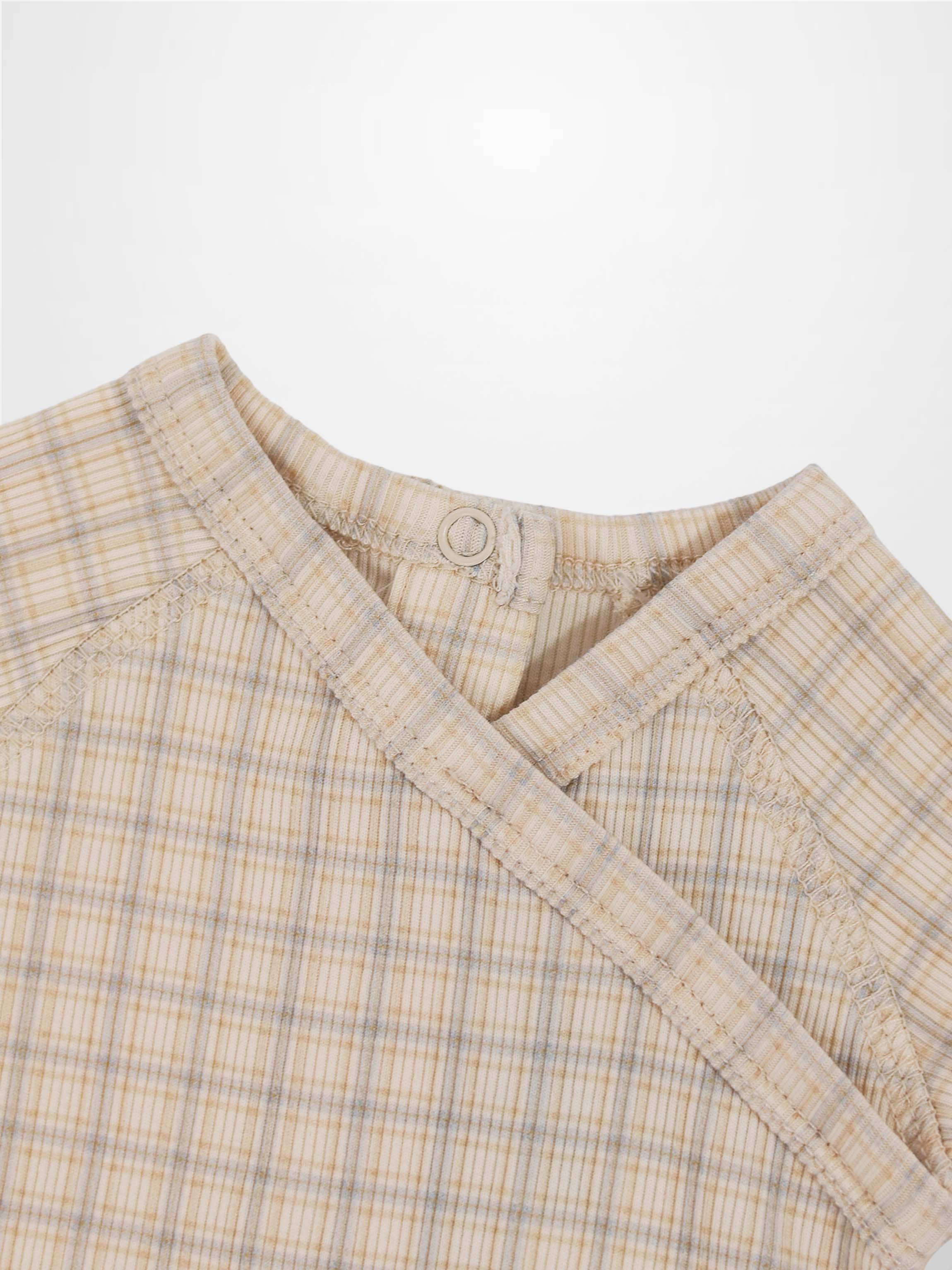 Oatmeal grid-pattern baby jumpsuit in beige with light blue plaid, crossover neck and back snap.