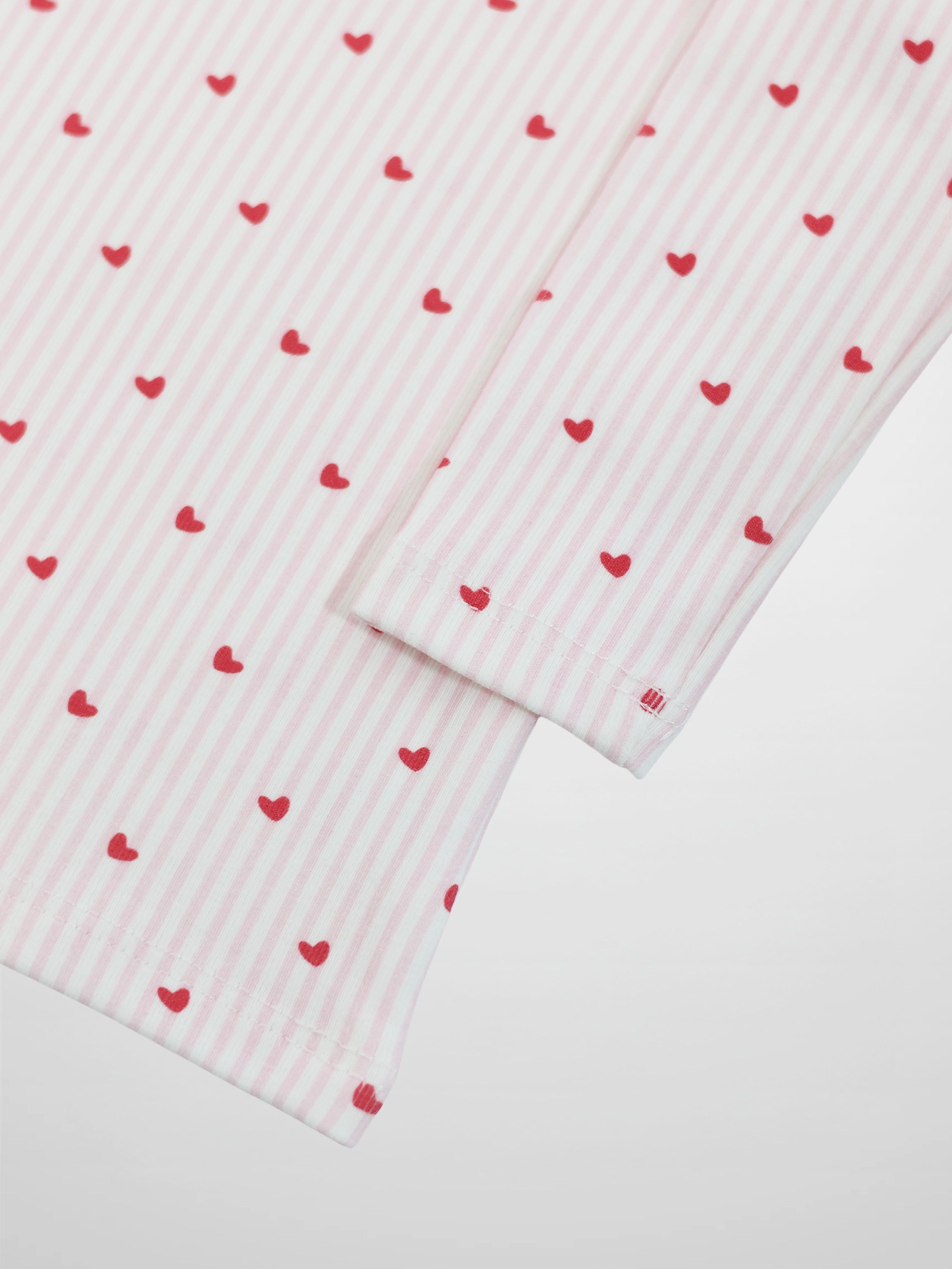 Pink Heart Pajamas for girls; pink striped fabric with red hearts.