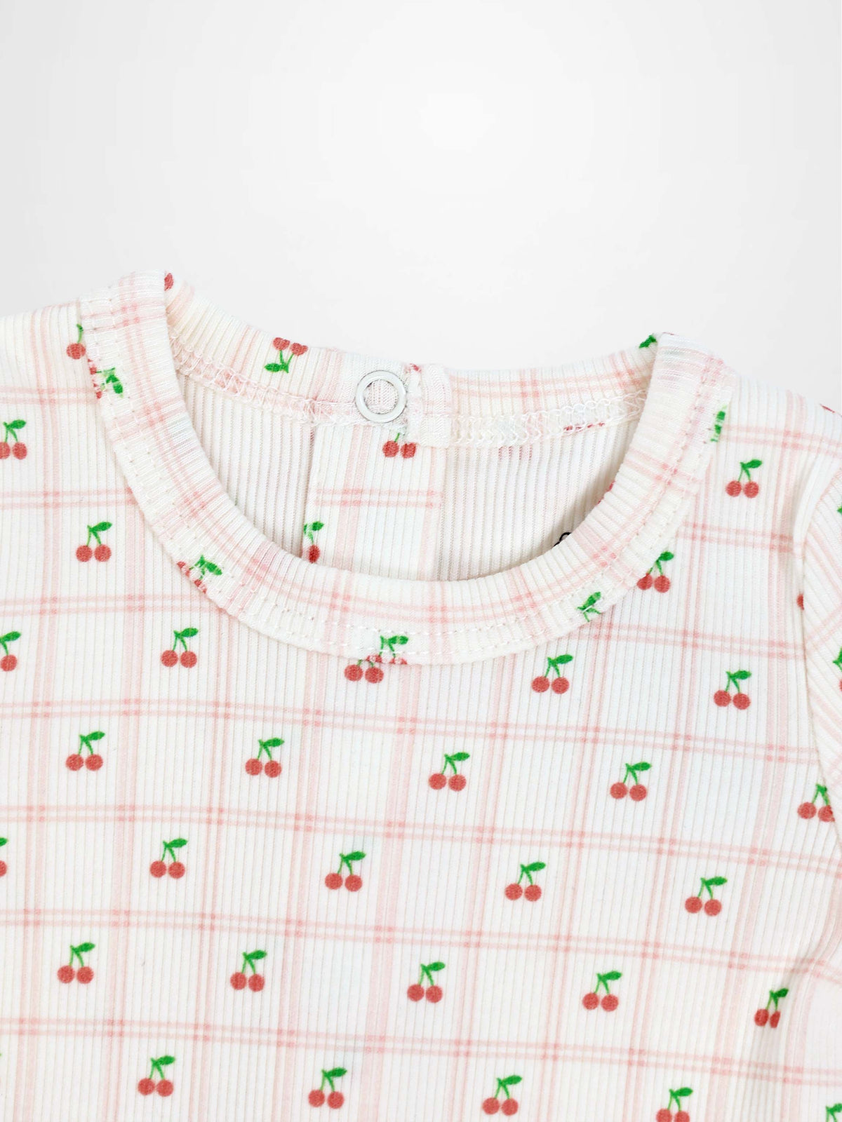 Cherry Window Stretchy girls top featuring tiny red cherries on pale pink plaid knit fabric with round neckline
