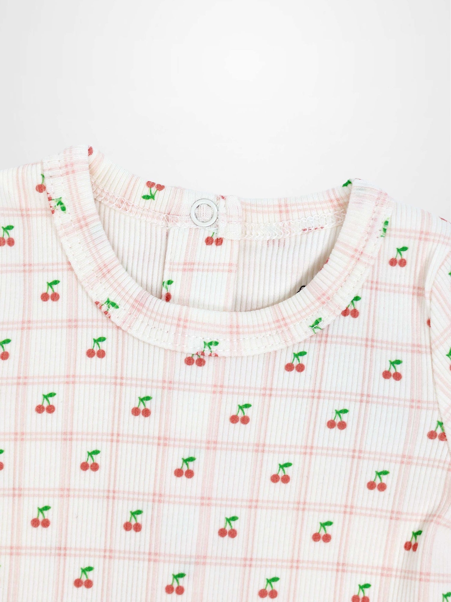 Cherry Window Stretchy girls top featuring tiny red cherries on pale pink plaid knit fabric with round neckline