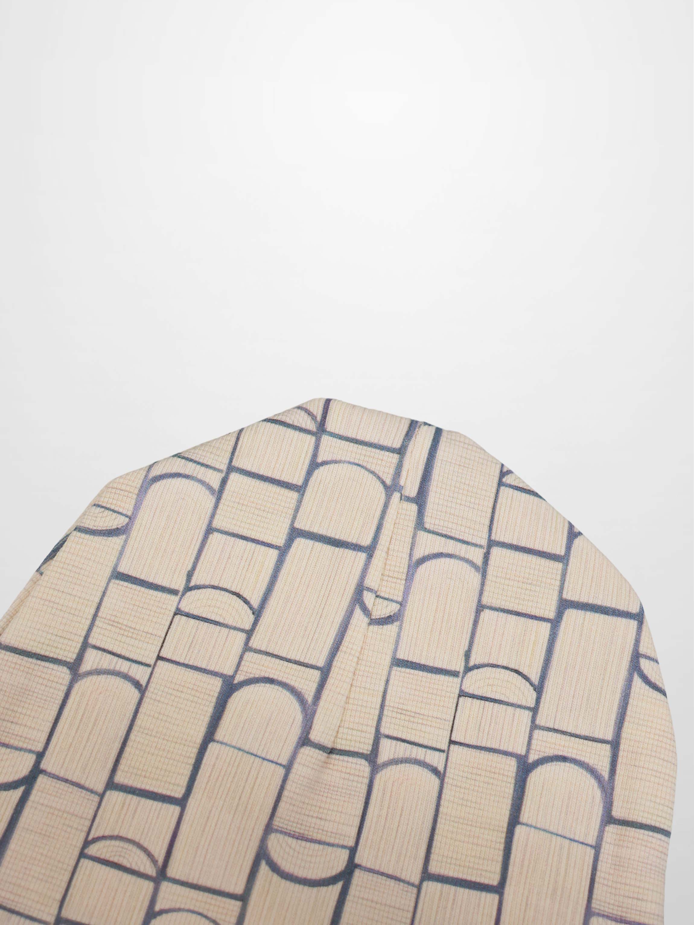 Geometric hat for boys; beige fabric with navy grid pattern.