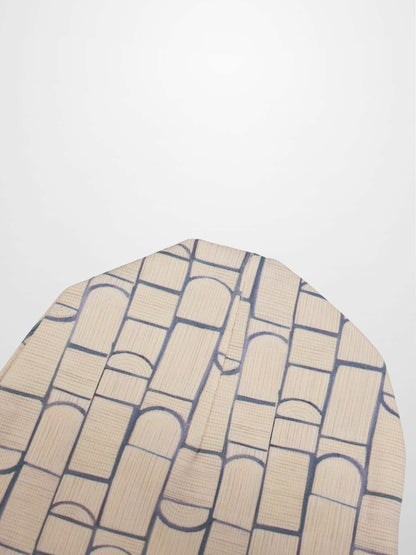 Geometric hat for boys; beige fabric with navy grid pattern.