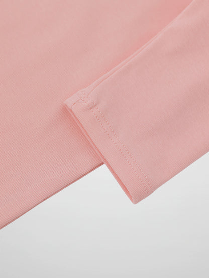 Close-up of light pink 3/4 sleeve T-shirt cuff with stitching.