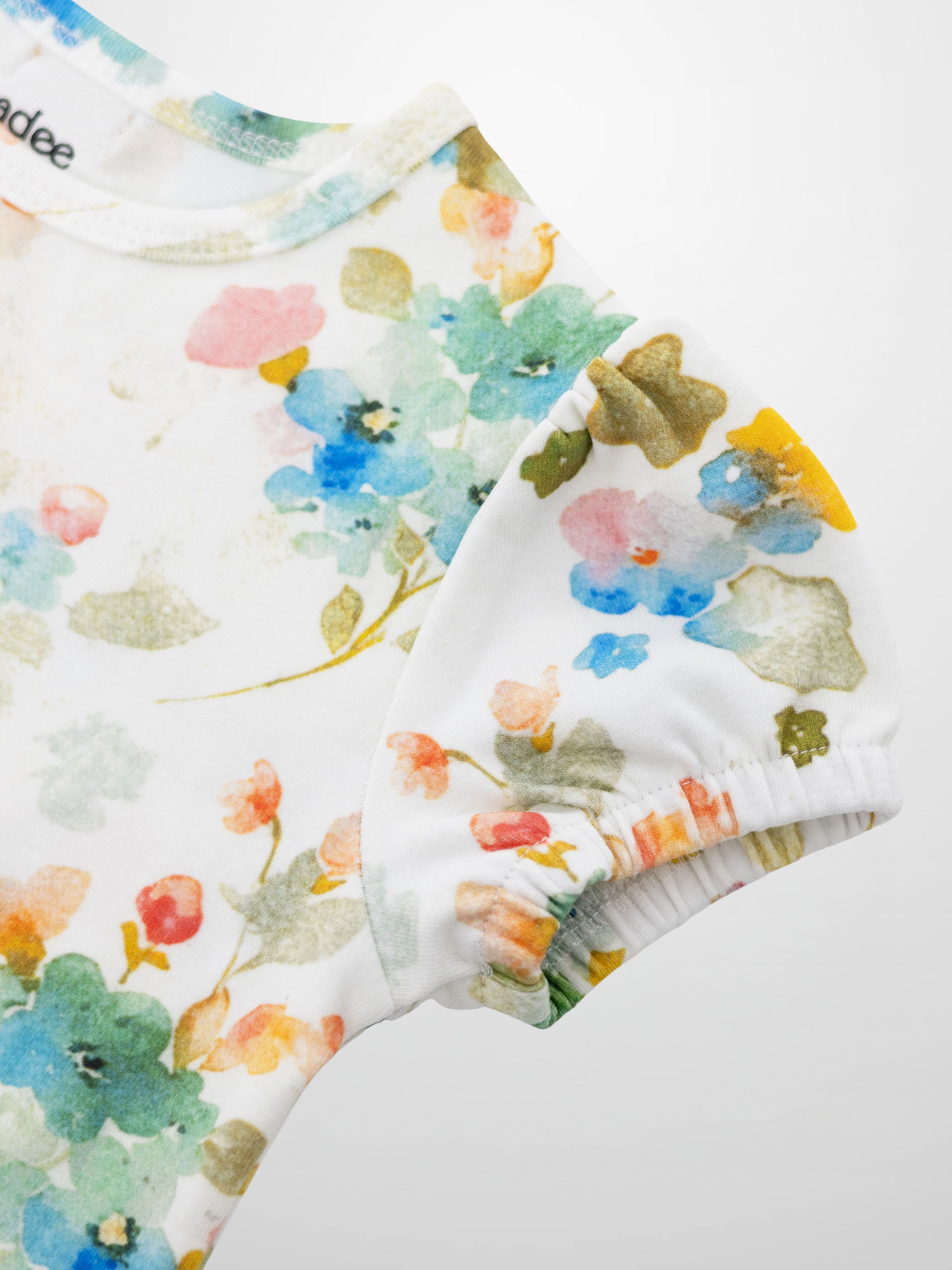 Pastel Flower Short Puff Sleeve T-shirt for girls, white with watercolor floral print, Adee brand.