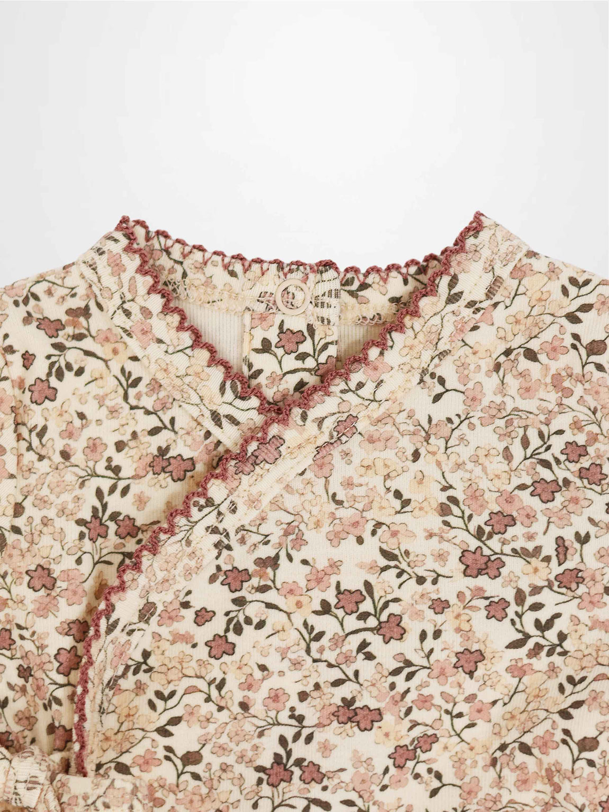 Purple Flower Stretchy girls stretchies with all-over pink floral print on cream background