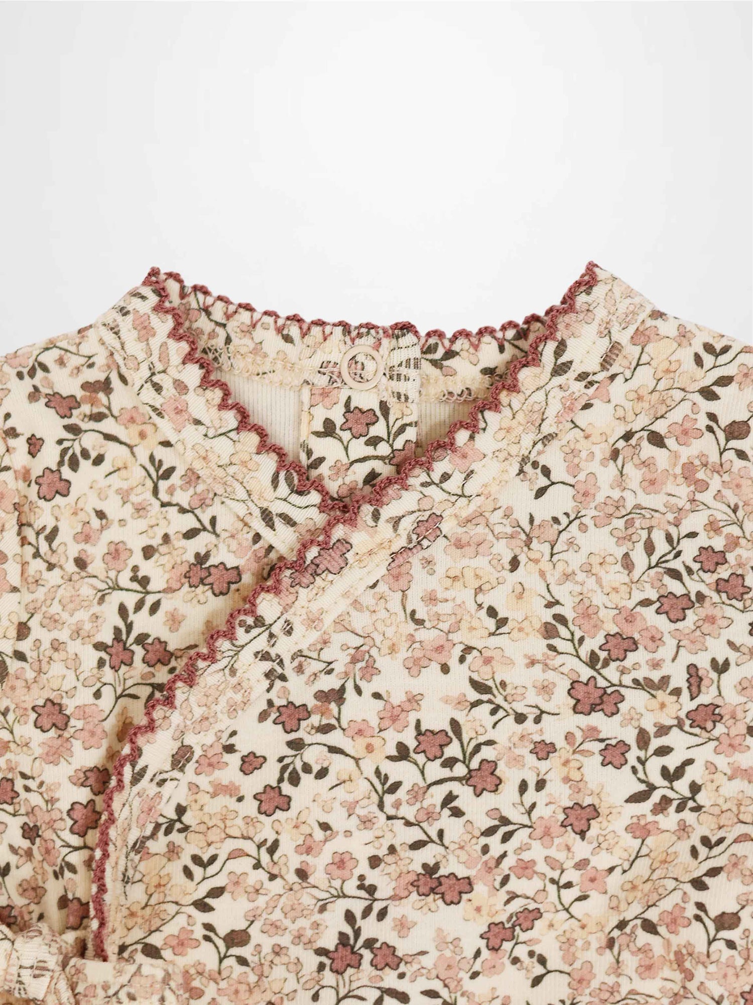 Purple Flower Stretchy girls stretchies with all-over pink floral print on cream background