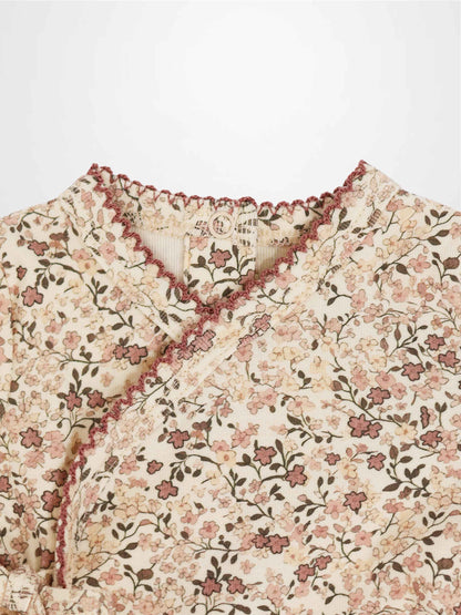 Purple Flower Stretchy girls stretchies with all-over pink floral print on cream background