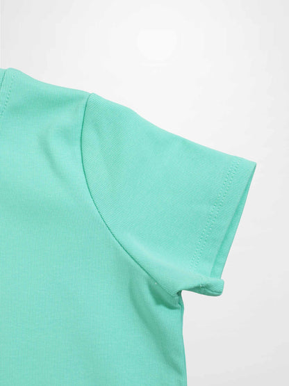 Mint green thin ribbed T-shirt sleeve close-up with visible stitching.