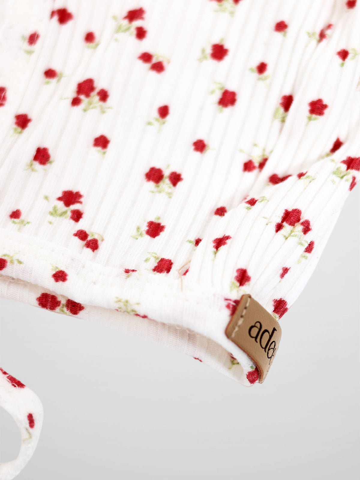 Red Flower Bonnet for girls by Adee, white fabric with delicate red floral print