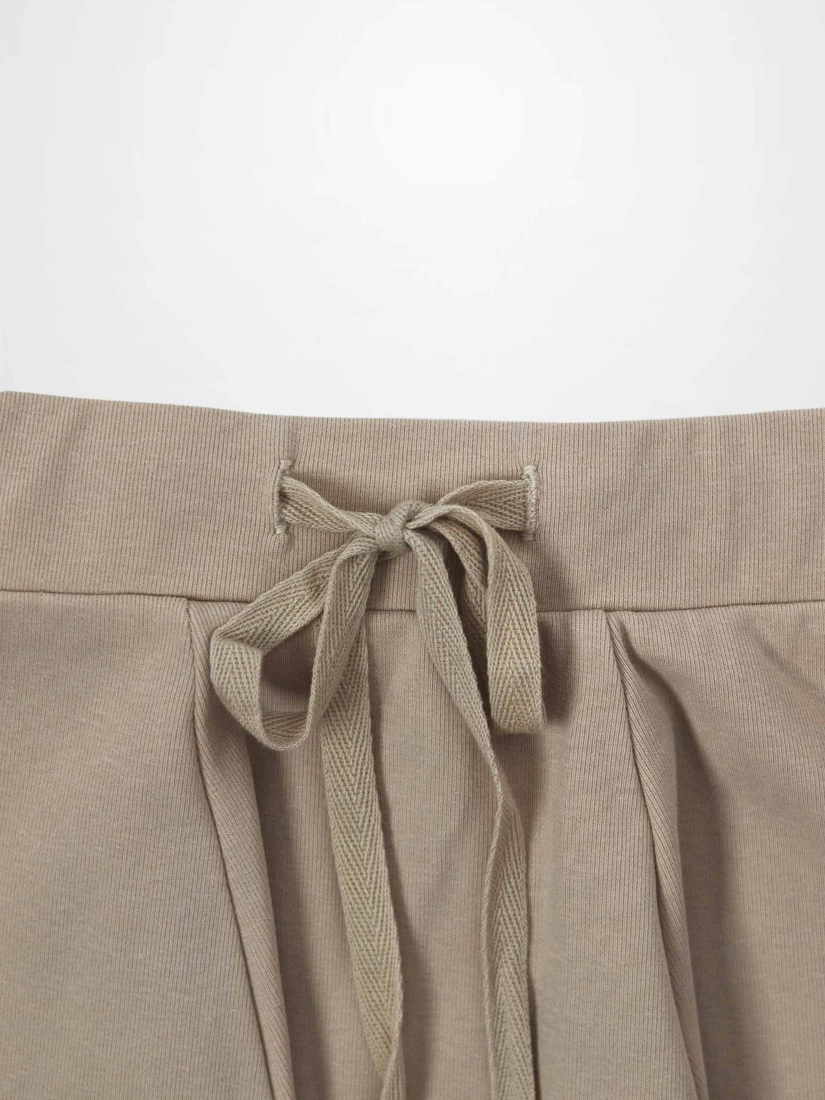 Taupe 6-panel skirt with waist tie belt tied in a bow at back