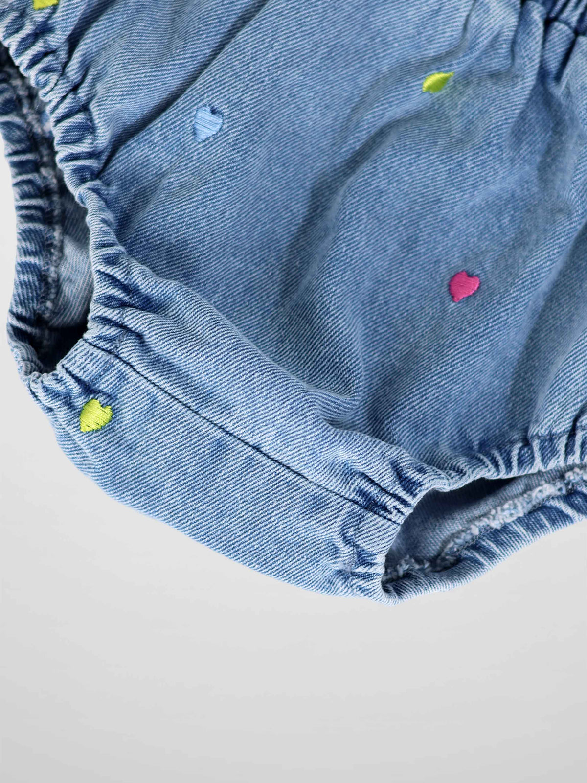 Embroidered Heart Denim Bloomers for girls, light blue denim with colorful heart embroidery and elastic leg openings.