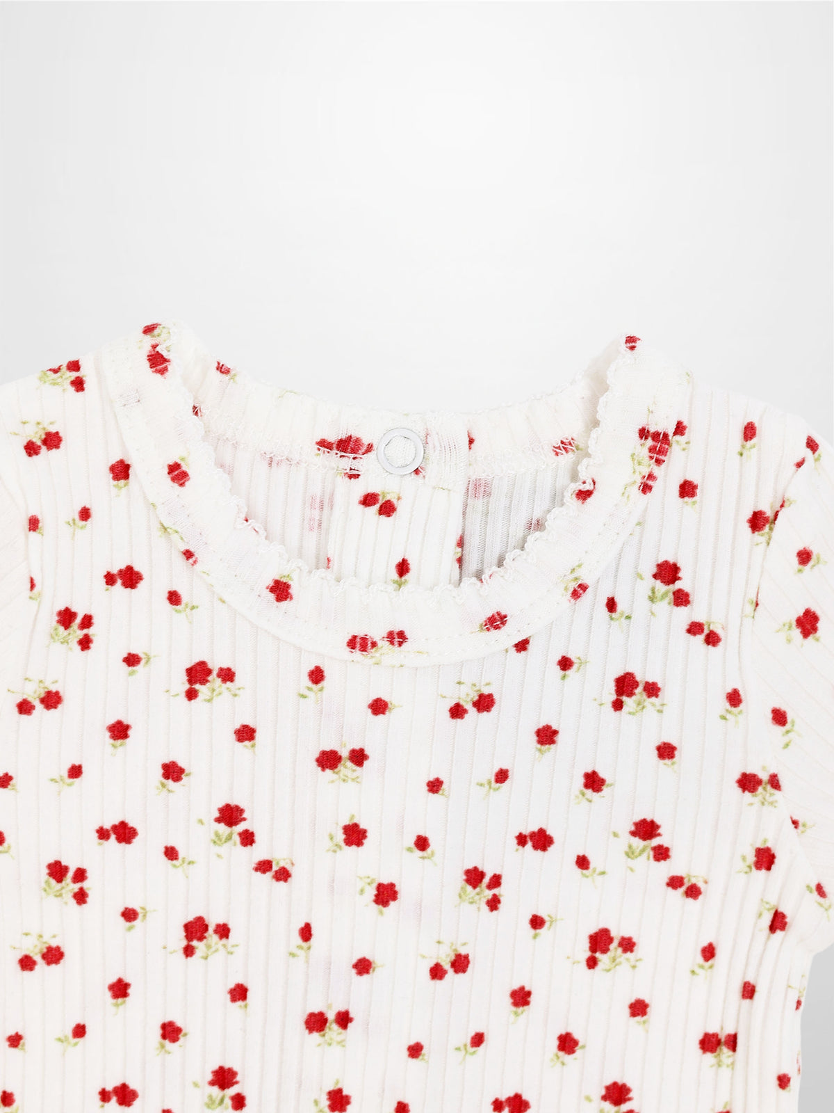 Red Flower Stretchy girls top in white ribbed knit with tiny red flowers scattered