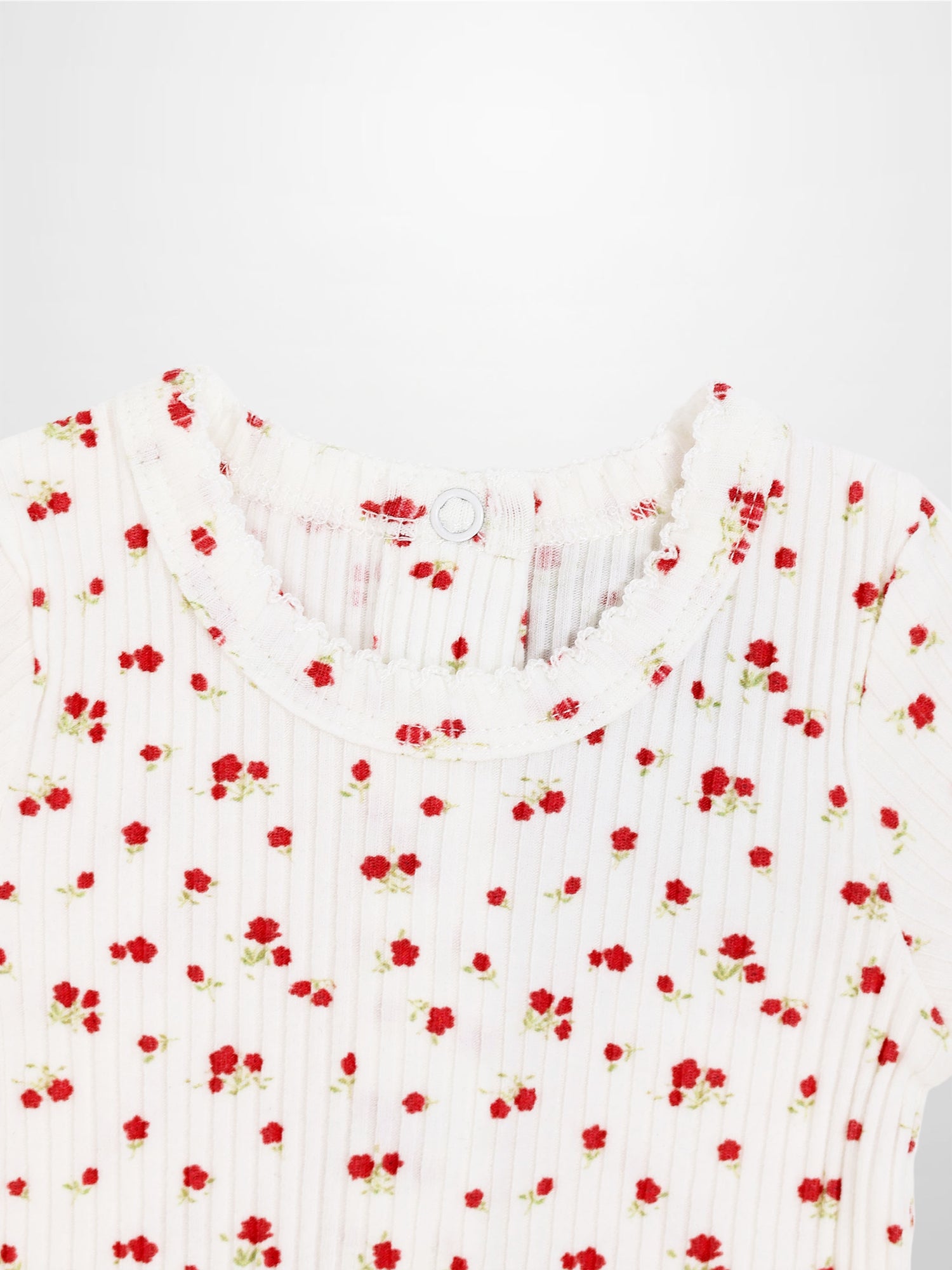 Red Flower Stretchy girls top in white ribbed knit with tiny red flowers scattered