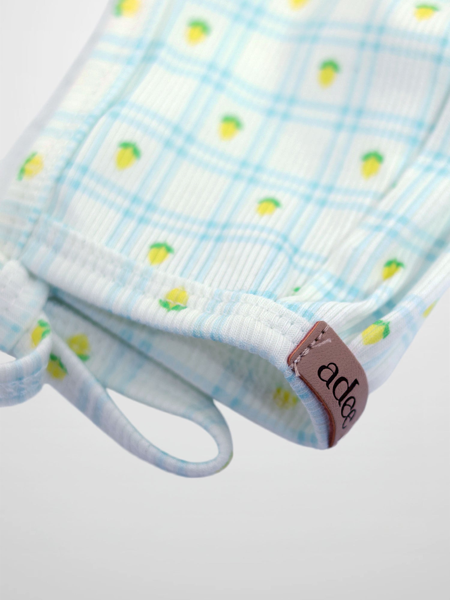 Lemon Window Bonnet for boys by Adee, light blue plaid fabric with lemon print