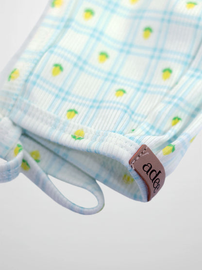 Lemon Window Bonnet for boys by Adee, light blue plaid fabric with lemon print