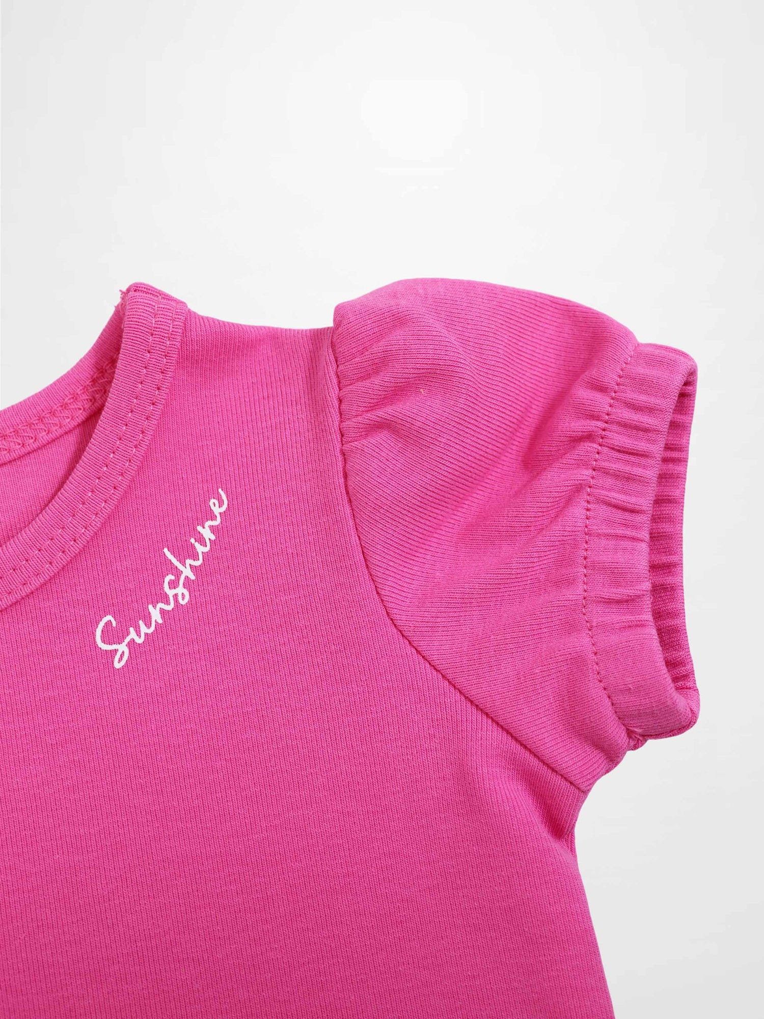 Pink short-sleeve bubble T-shirt for girls with puff sleeve detail.