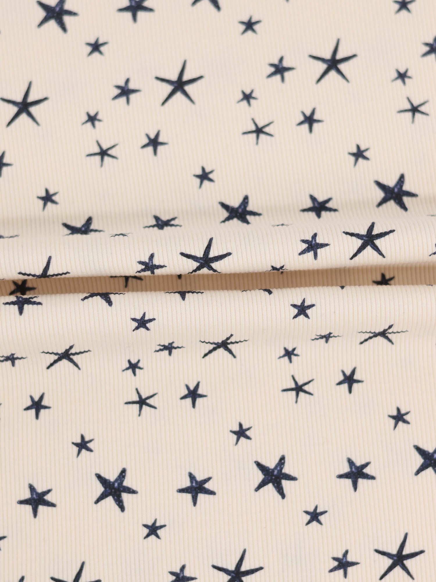 Star Blanket by Adee; ivory boys swaddle blanket with navy star print.