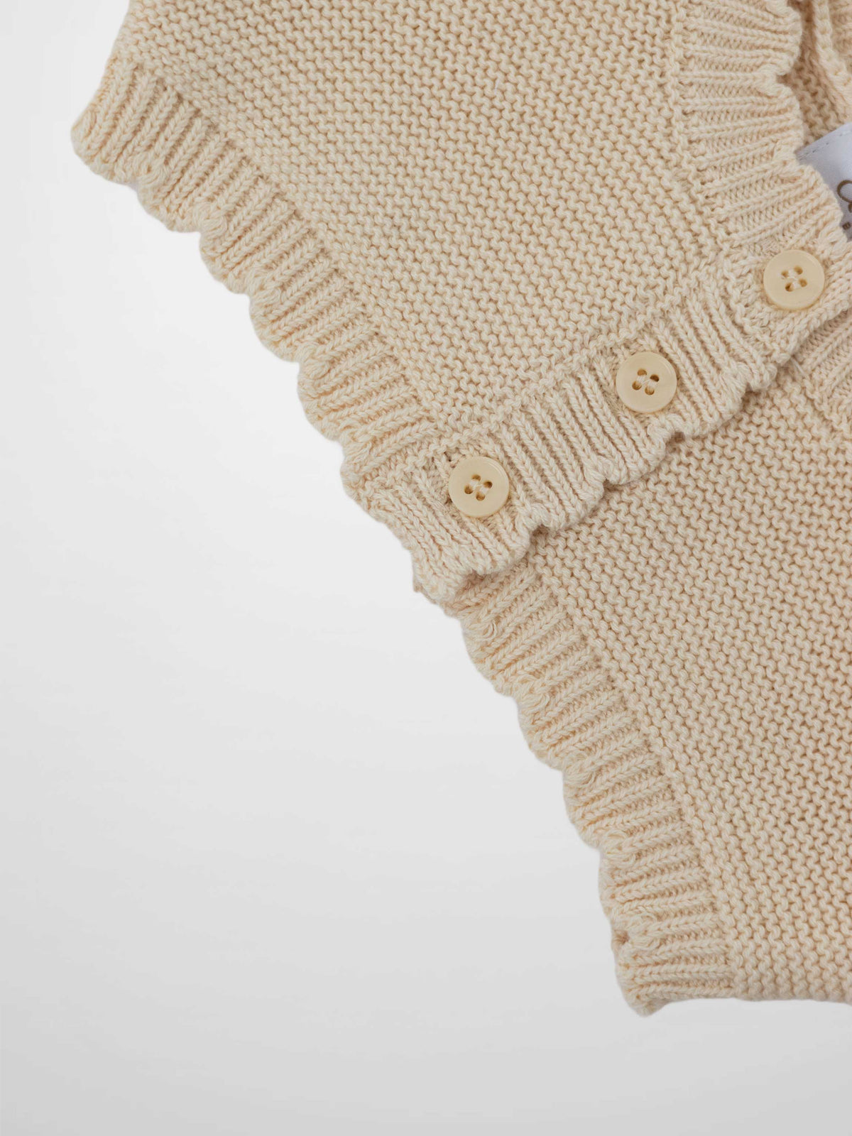 Cropped Cardigan with Lace - Ivory; knit girls top with ribbed cuffs and beige buttons.