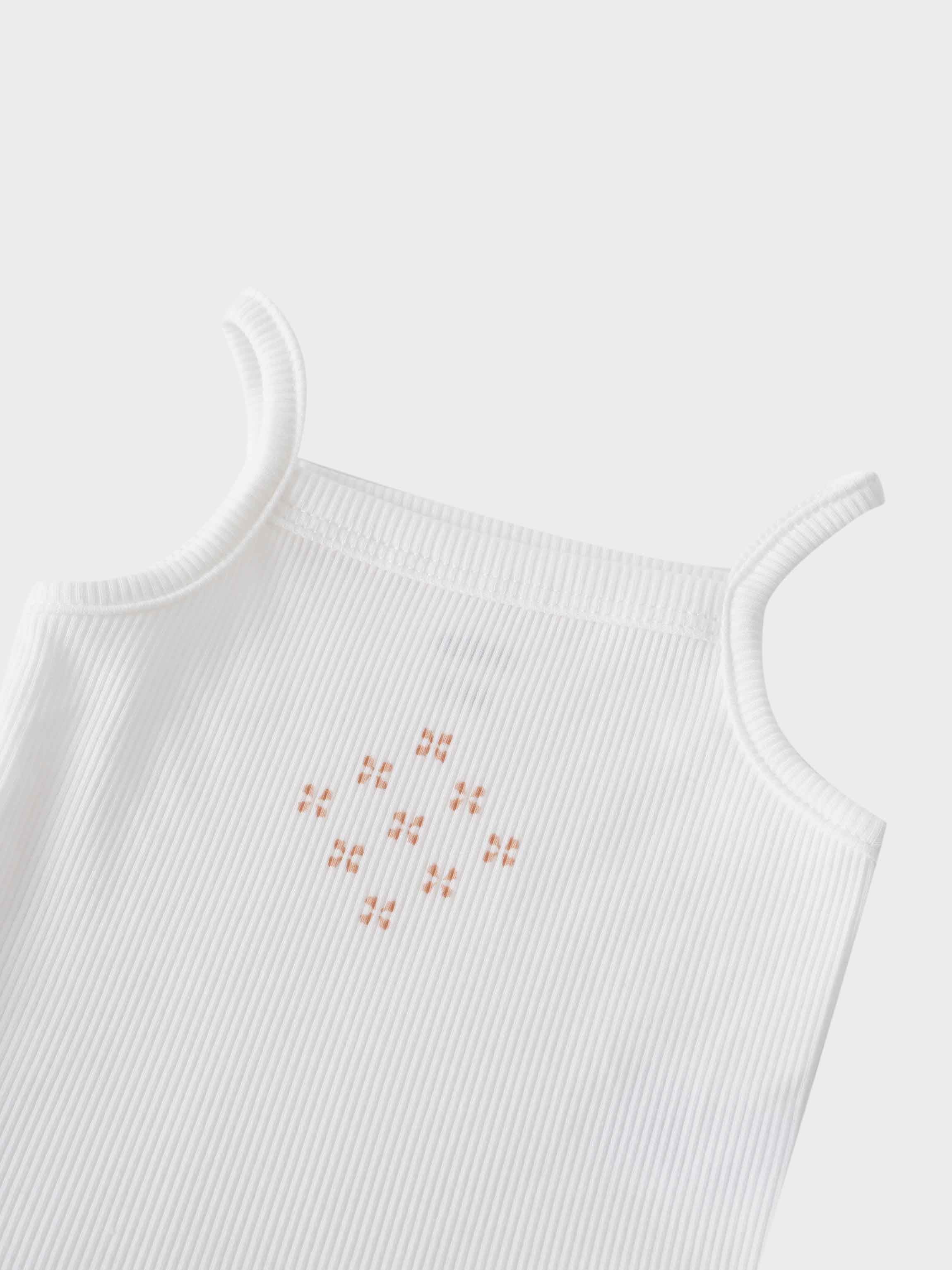 White bodysuit with diamond pattern