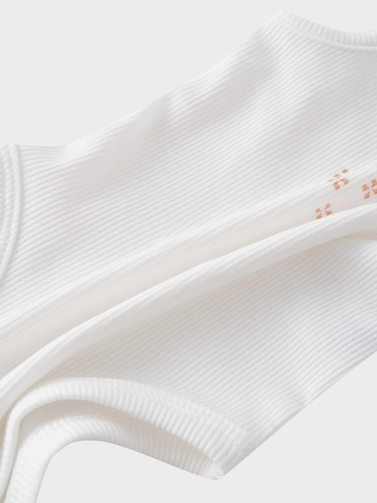 White ribbed baby bodysuit fabric