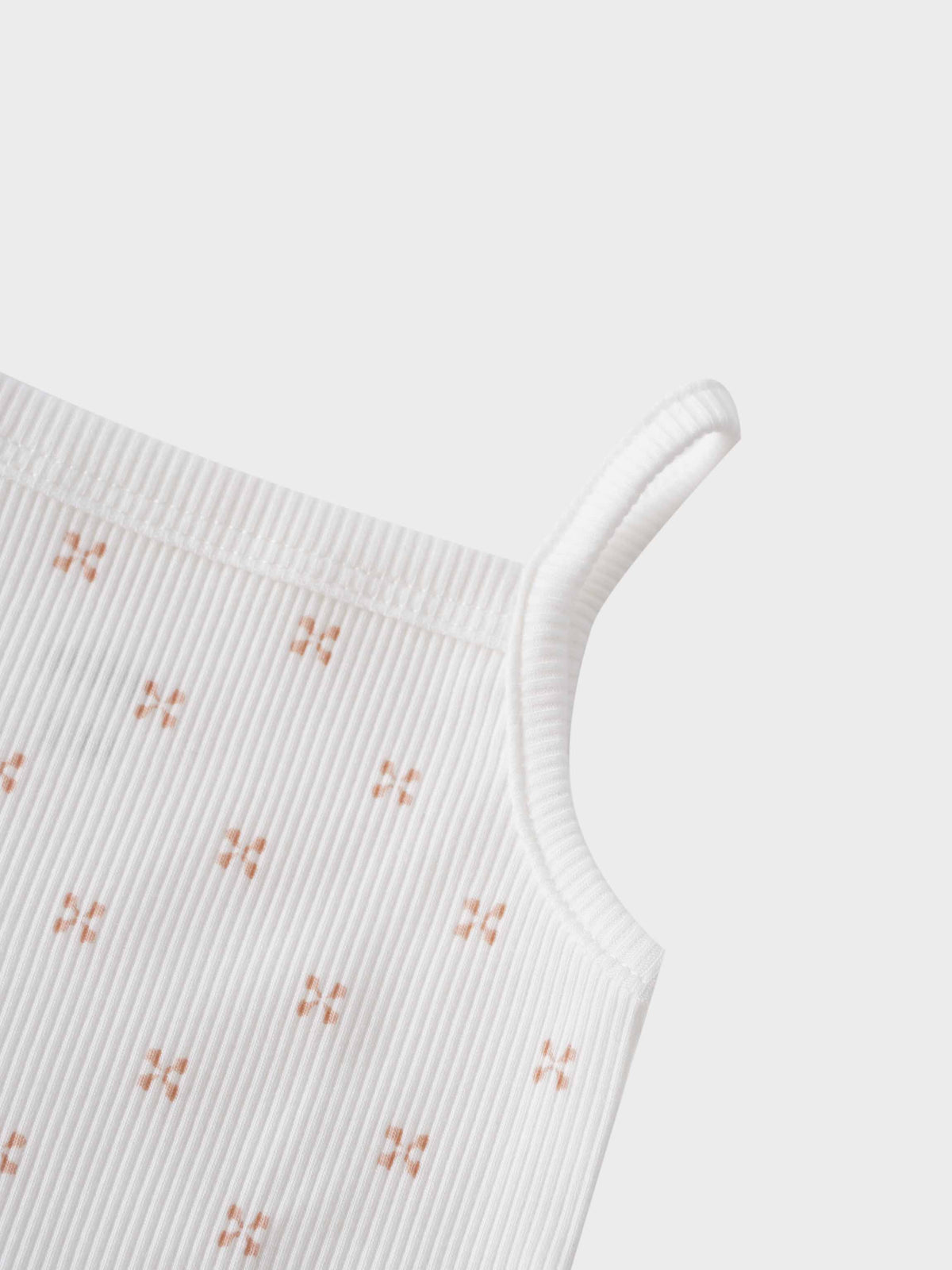 Pink diamond patterned baby bodysuit