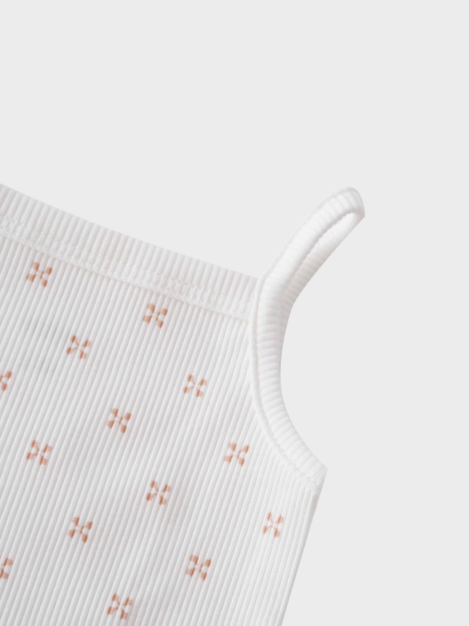 Pink diamond patterned baby bodysuit