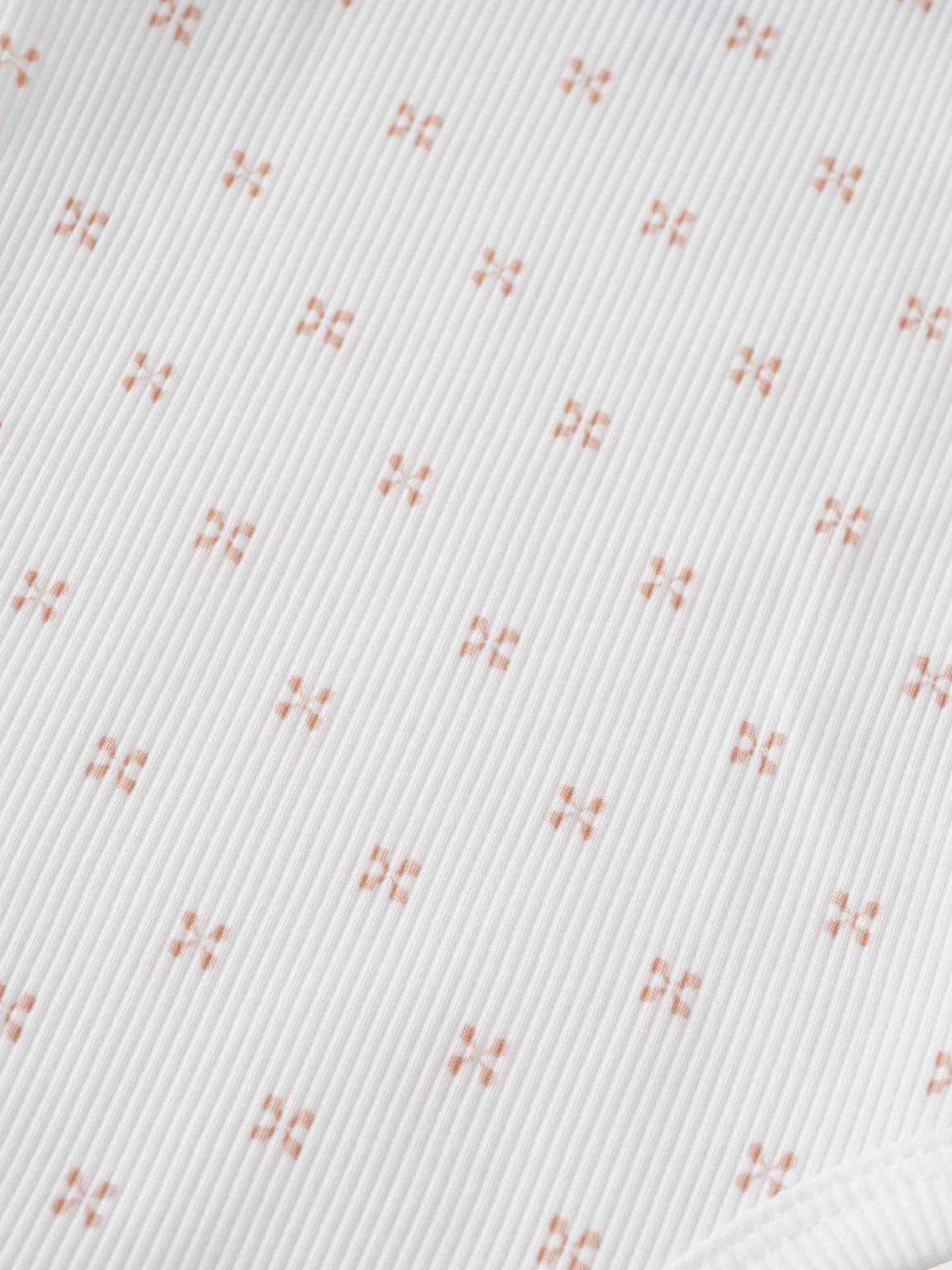 Pink diamond pattern fabric close-up