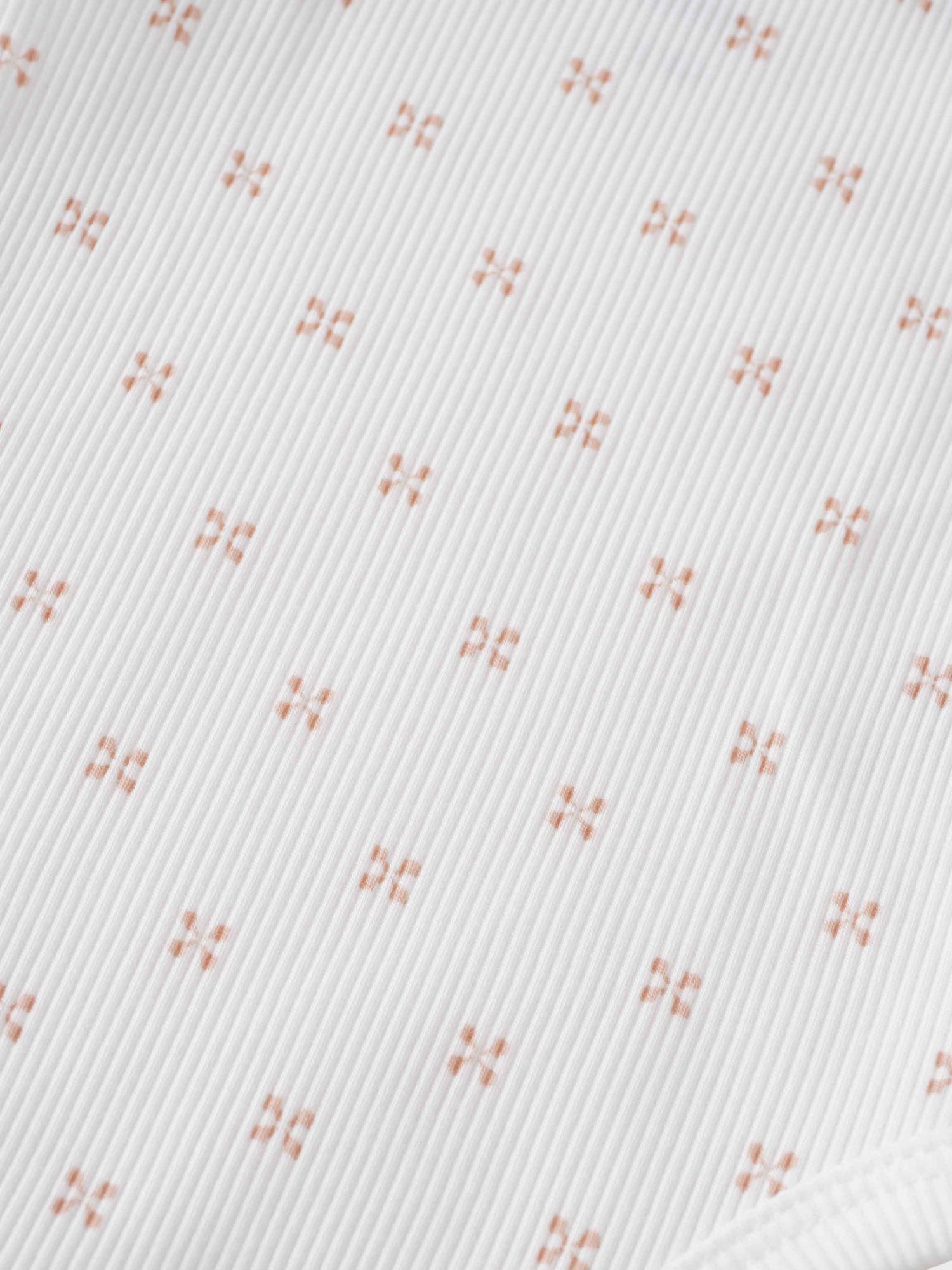 Pink diamond pattern fabric close-up