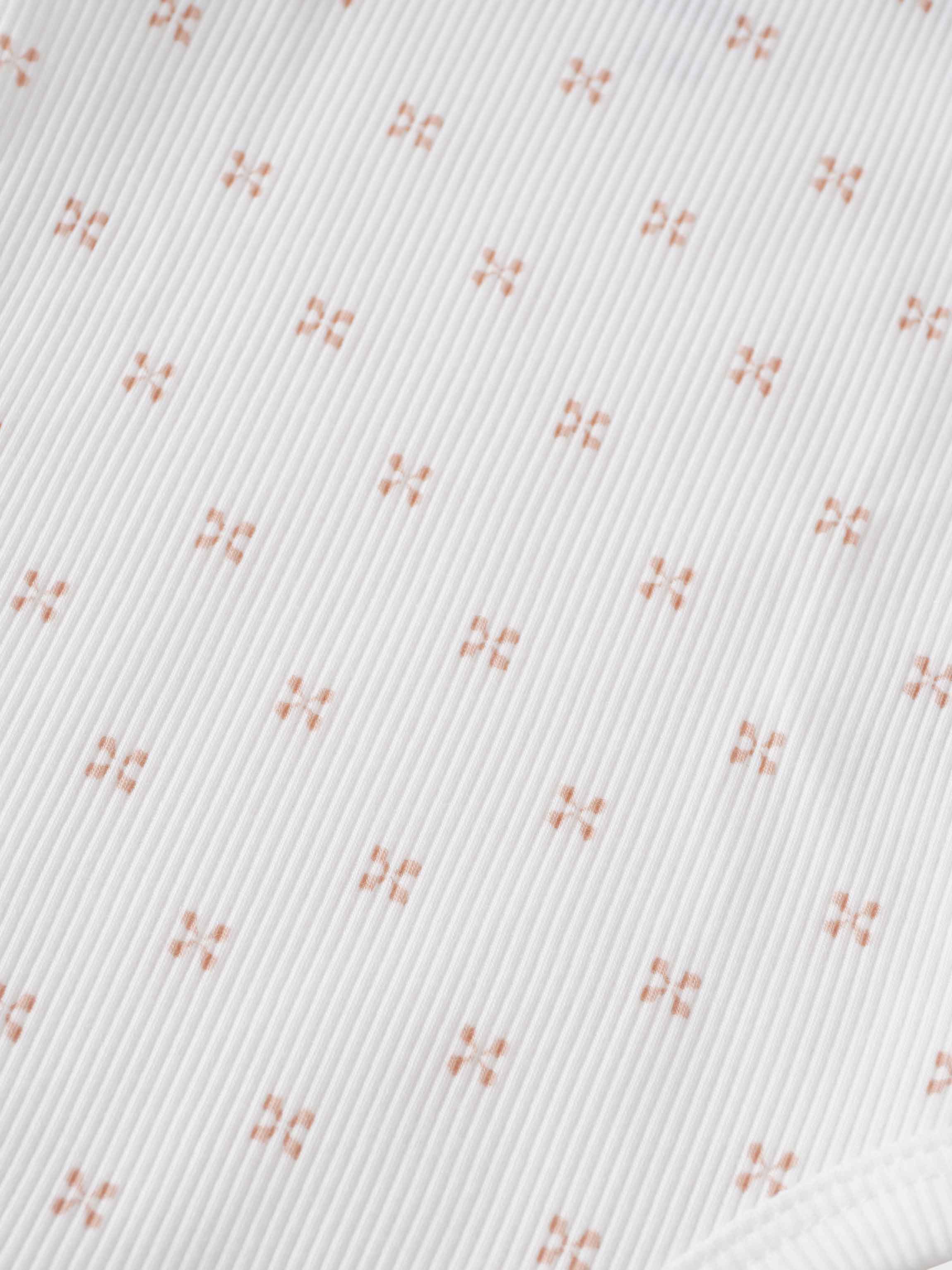 Pink diamond pattern fabric close-up