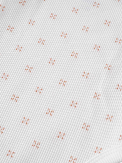 Pink diamond pattern fabric close-up