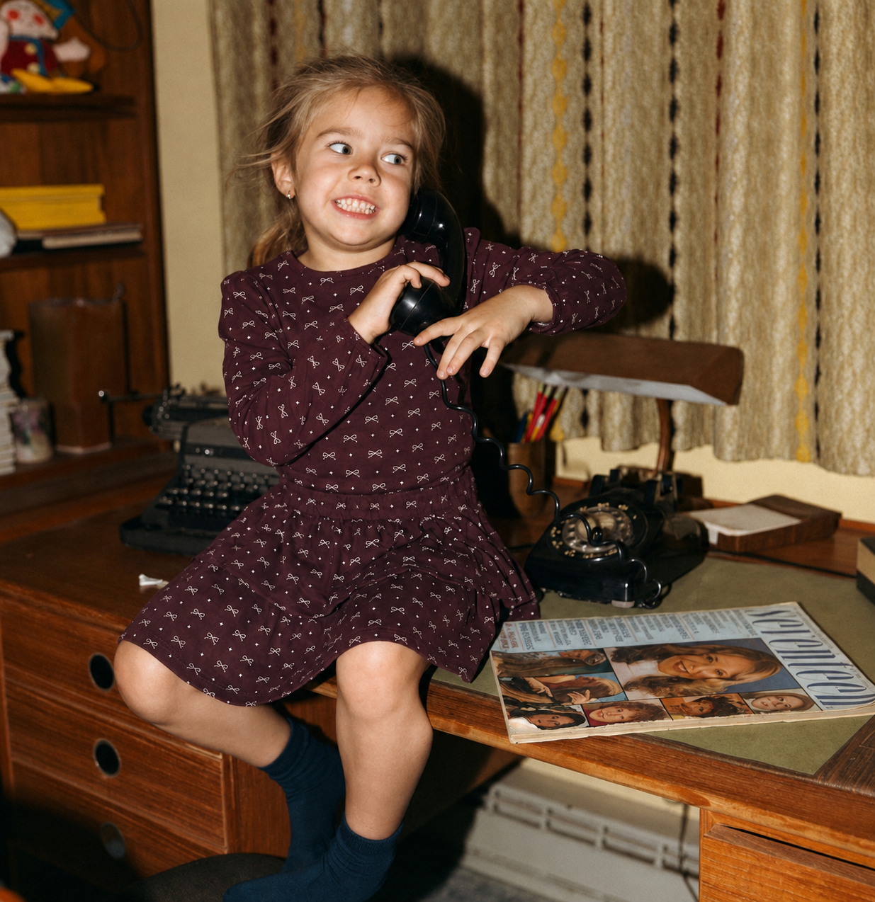 Burgundy Bow Layered Skirt for girls by Adee worn by a smiling child