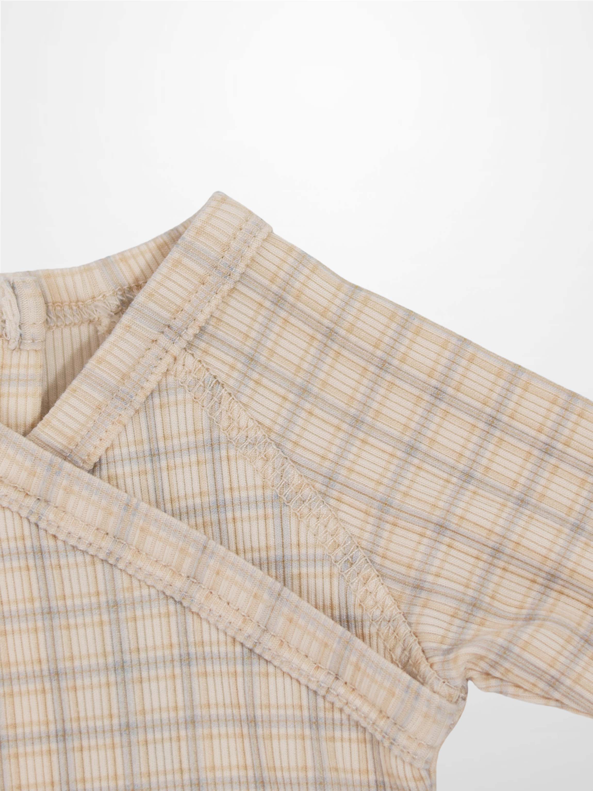 Oatmeal grid stretchy baby jumpsuit footie in beige with light blue and brown plaid, breathable fabric, back snaps.