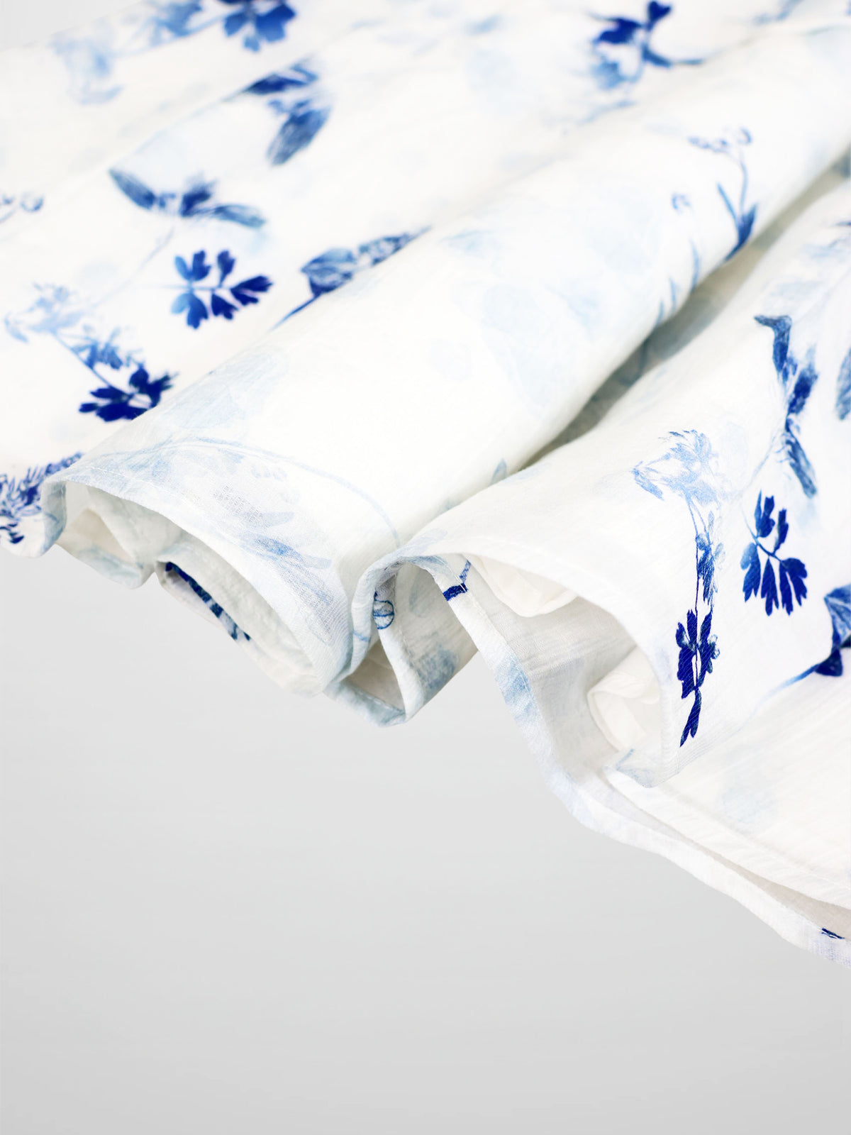 Blue Flower Skirt by Adee; girls dressy apparel featuring white fabric with vivid blue floral print.