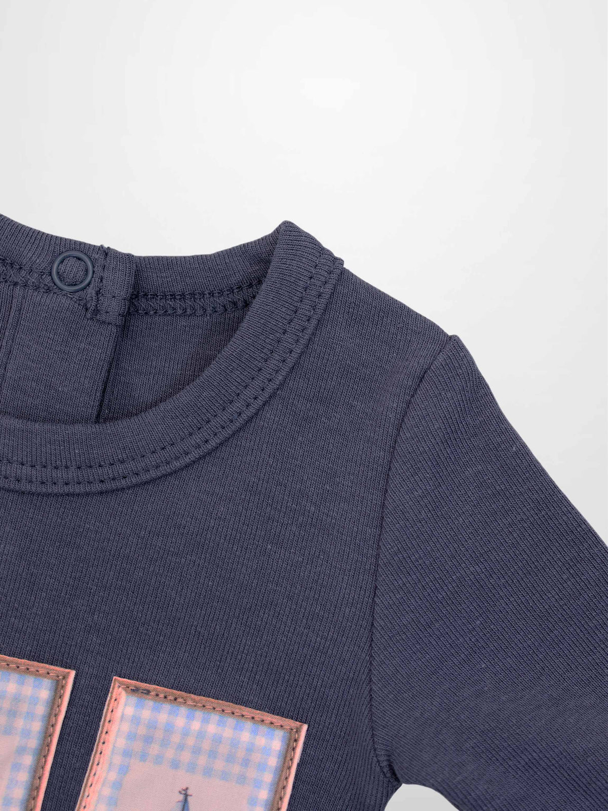 Teddy Frame Stretchy boys’ tee with pink-framed pastel plaid patches on navy fabric