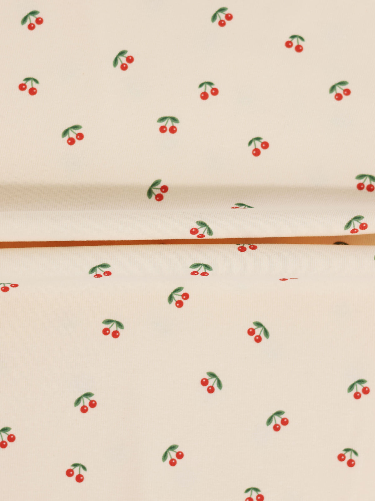 Red Cherry Hat on cream fabric with scattered red cherries and green leaves