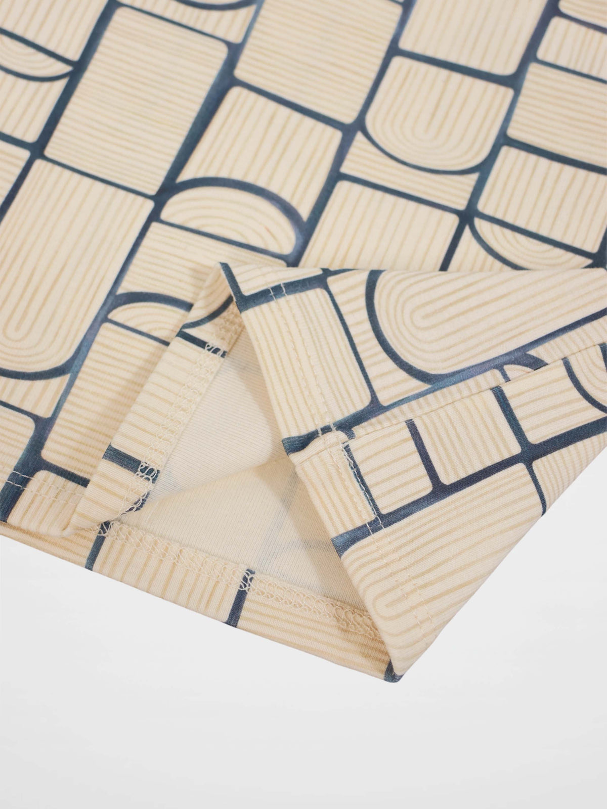 Abstract T-shirt for boys by Adee featuring a light-blue geometric print on beige fabric, suitable for everyday wear.