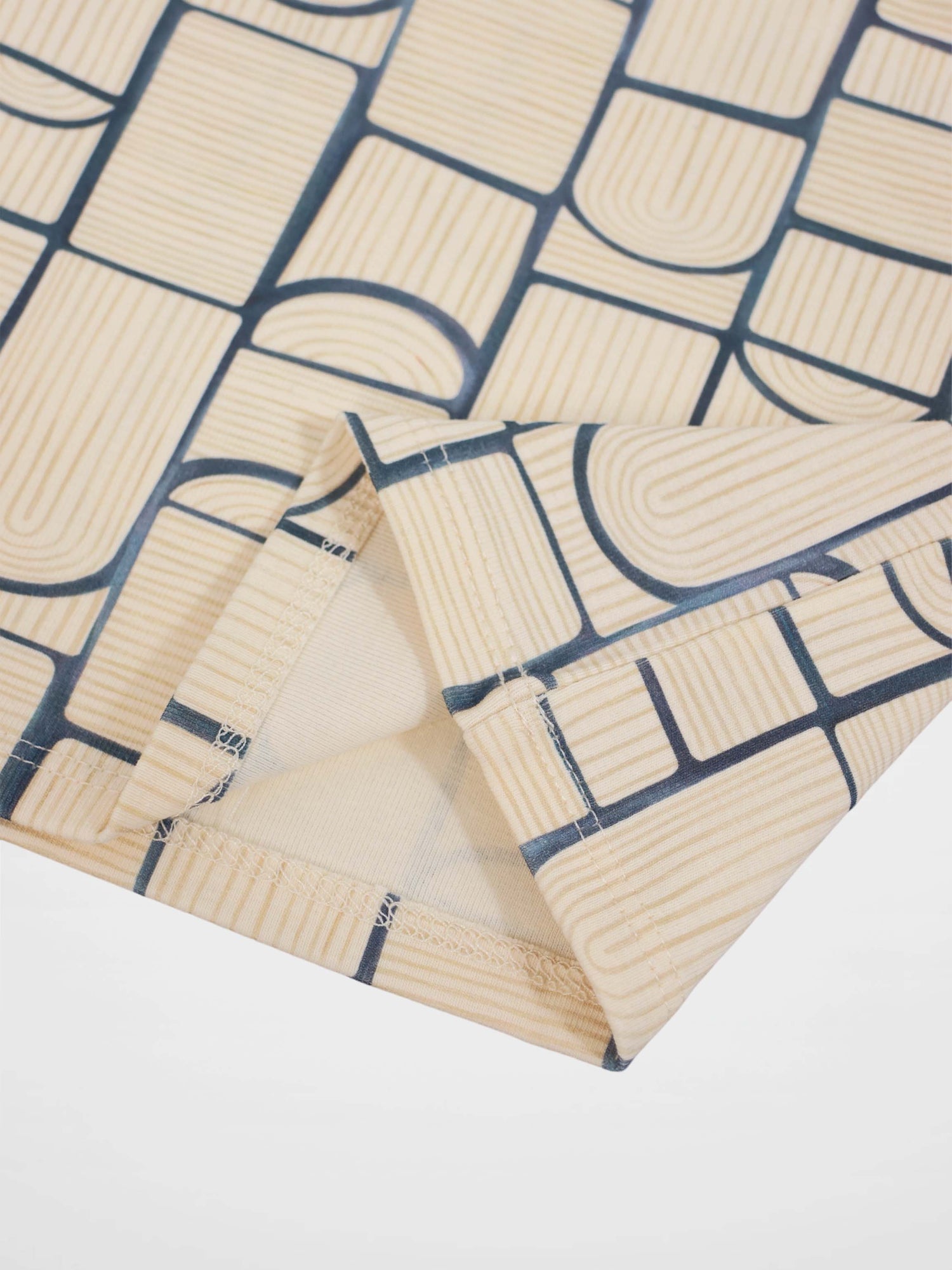 Abstract T-shirt for boys by Adee featuring a light-blue geometric print on beige fabric, suitable for everyday wear.