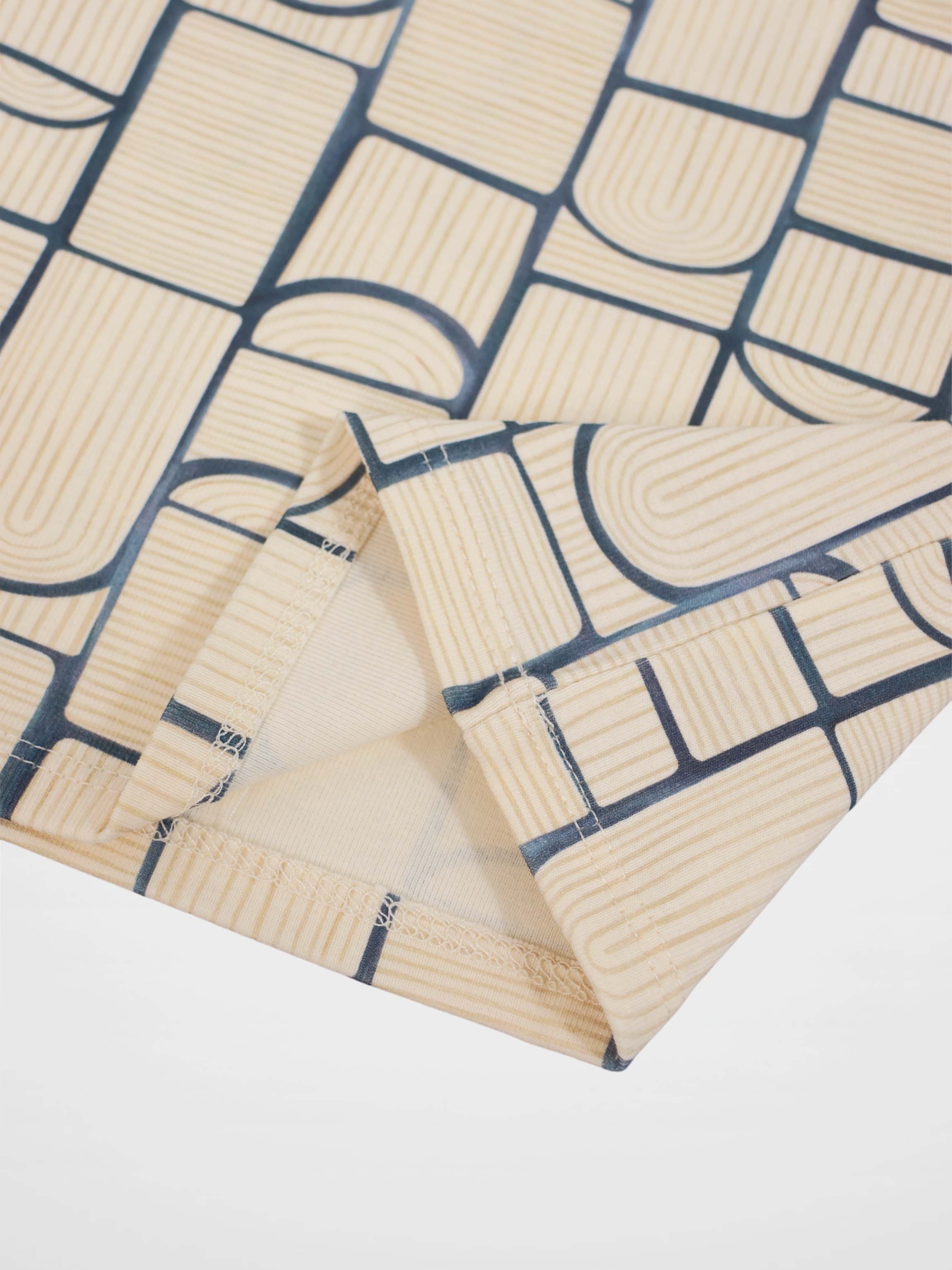 Abstract T-shirt for boys by Adee featuring a light-blue geometric print on beige fabric, suitable for everyday wear.