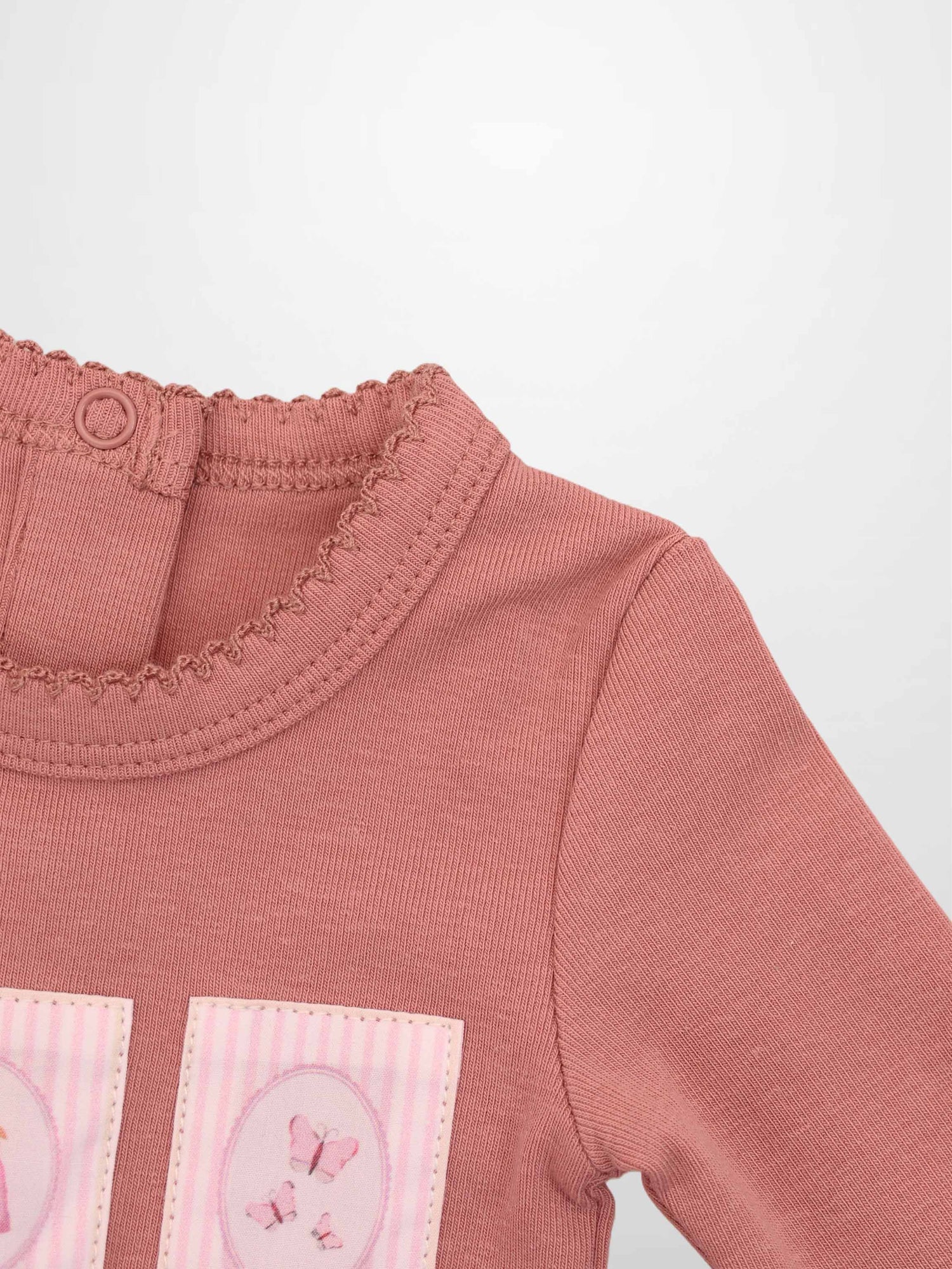 Cherry Frame Stretchy girls jumpsuit by Adee in muted pink knit with butterfly patches