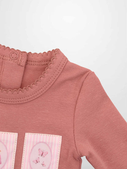 Cherry Frame Stretchy girls jumpsuit by Adee in muted pink knit with butterfly patches
