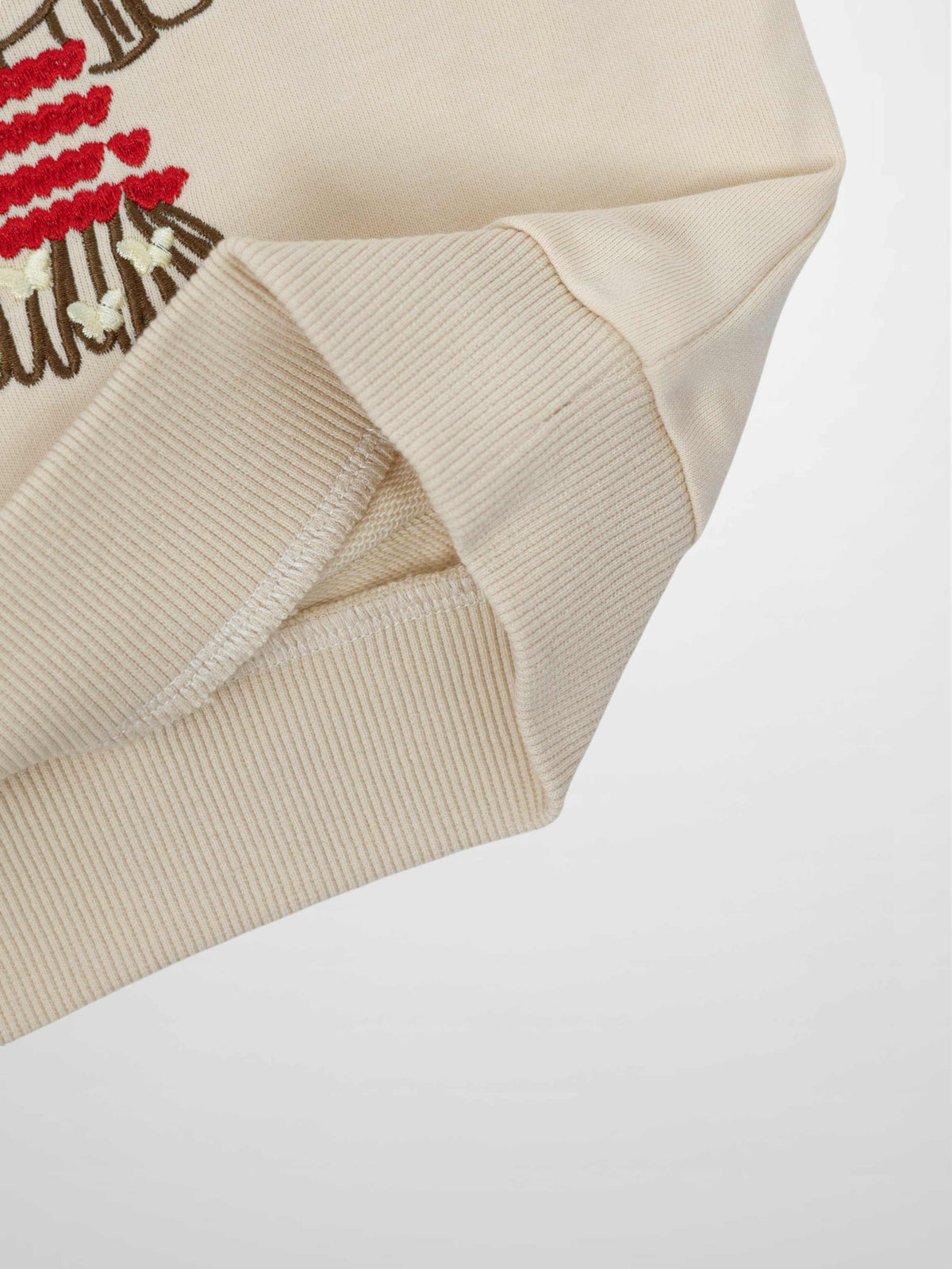 Embroidered Girl Sweatshirt by Adee in beige with ribbed cuffs.