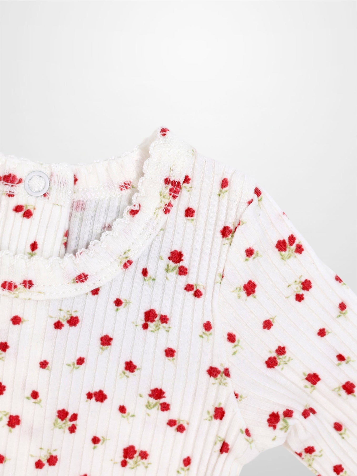 Red Flower Stretchy girls top in white ribbed fabric with tiny red flowers