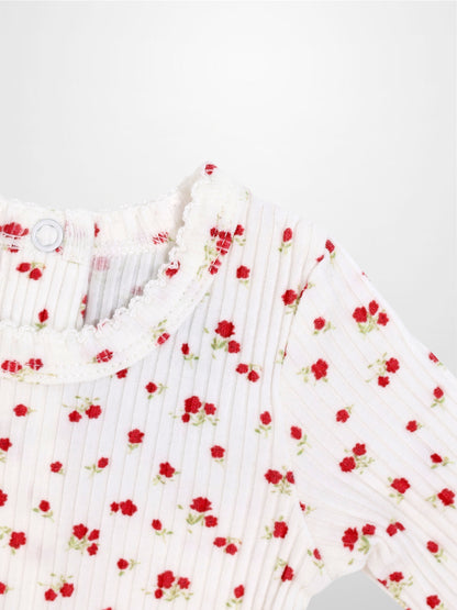 Red Flower Stretchy girls top in white ribbed fabric with tiny red flowers