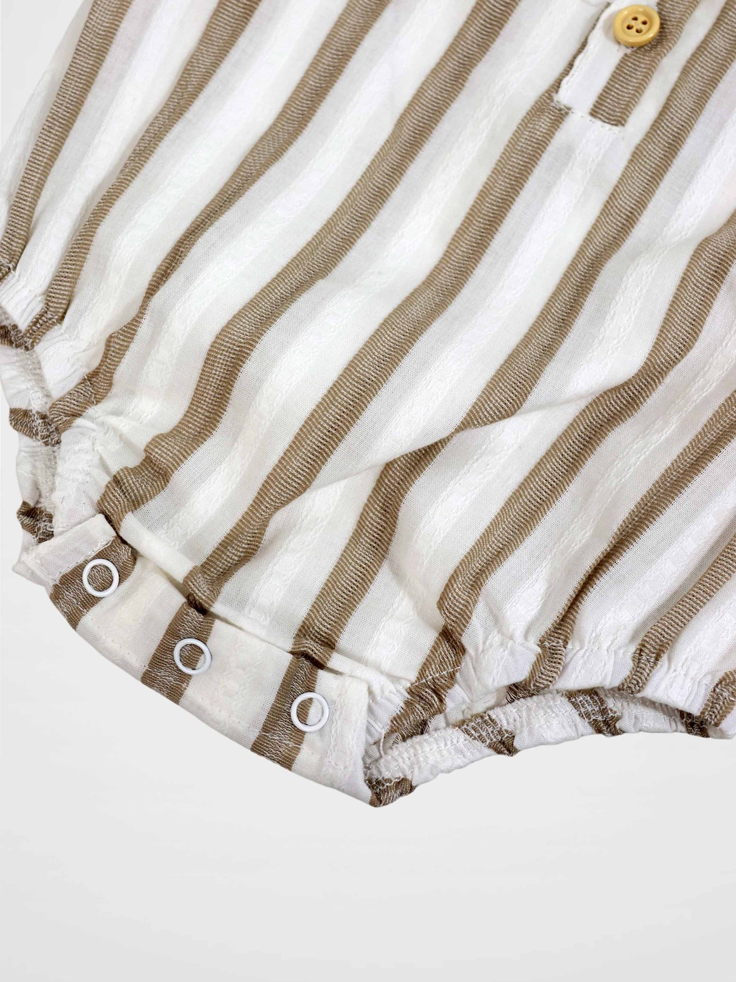 Tan and white striped romper with front button and snap-adjustable leg openings.