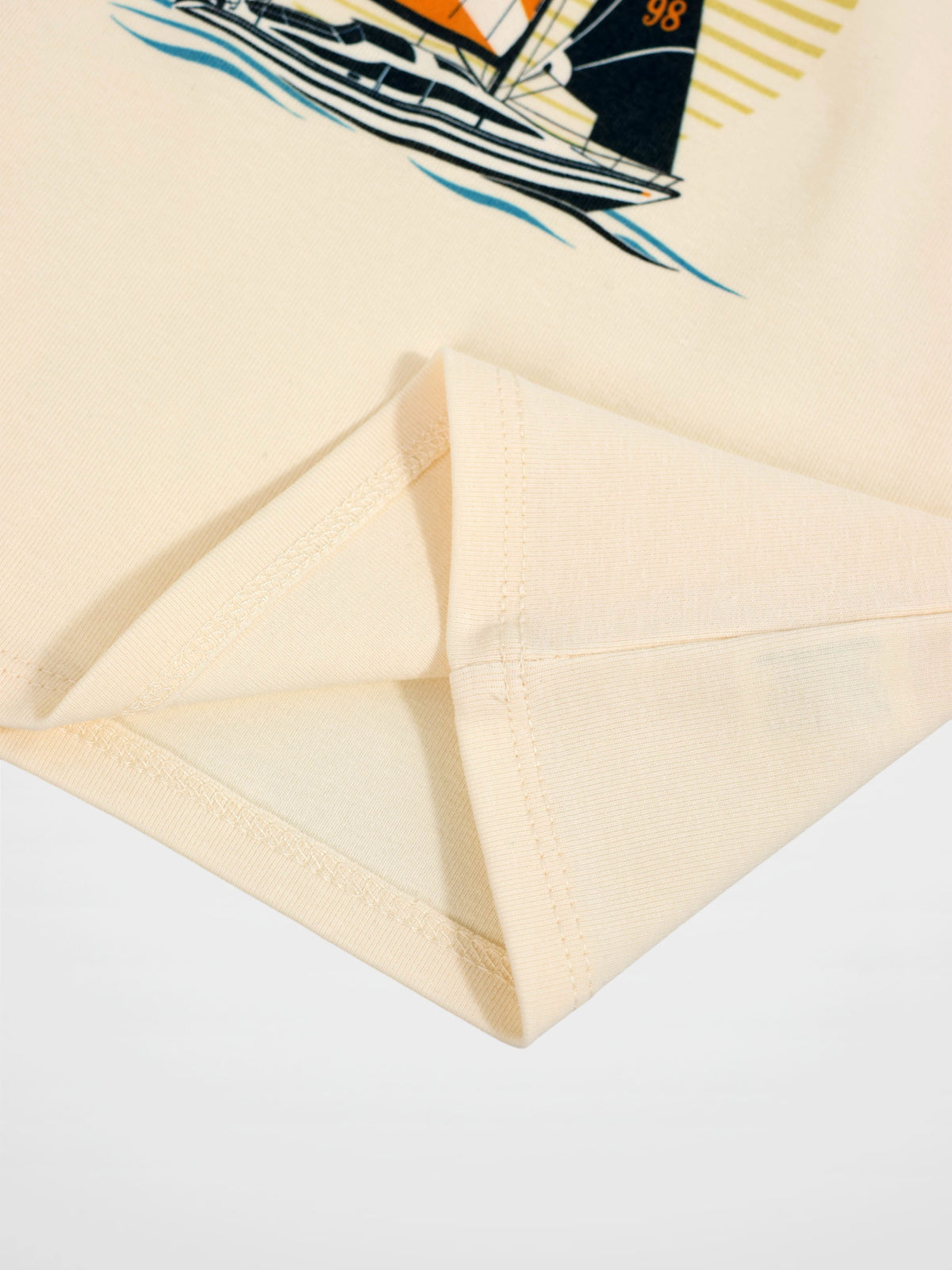 Golden Sail T-Shirt, beige with sailboat graphic, by Adee.